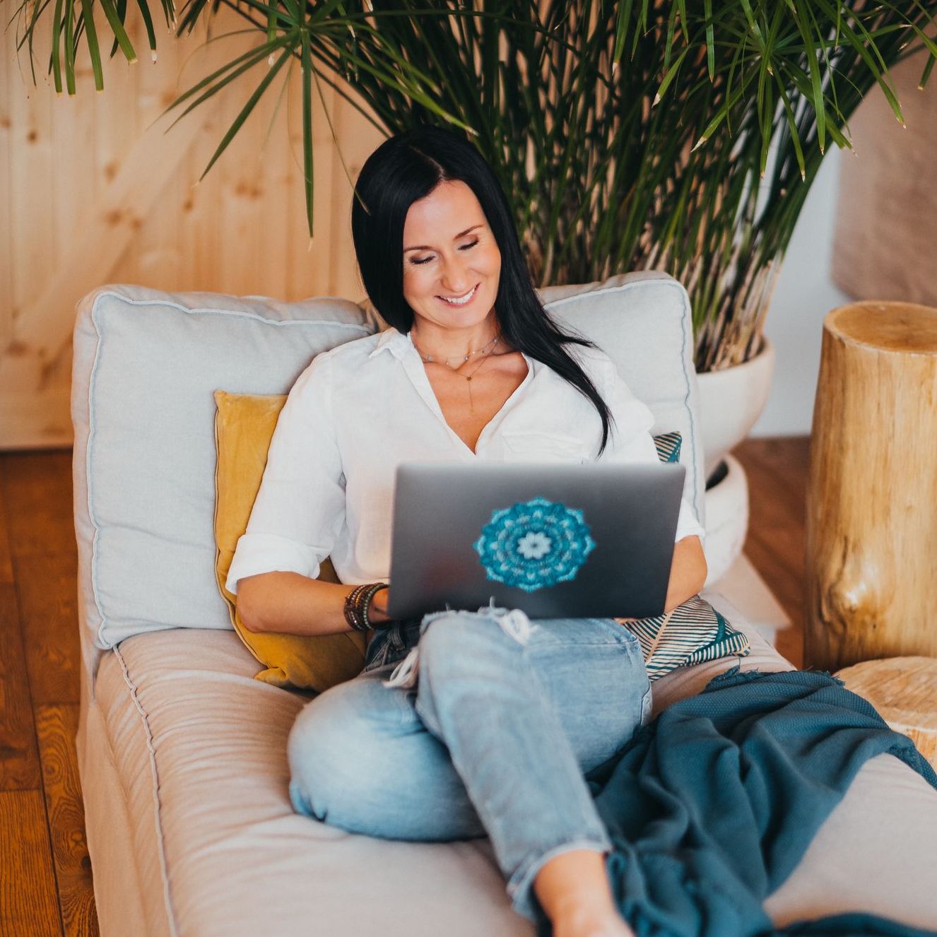 Two women, a business coach and her client, work together on a laptop, focused and engaged in finding directions for the client's business.